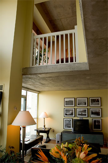 Urban loft is warmed up with soft yellow-green on walls